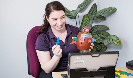 Therapist on a teletherapy session on a tablet device