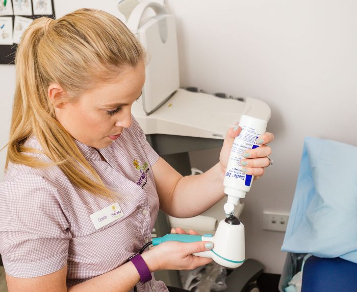 therapist prepares ultrasound procedure