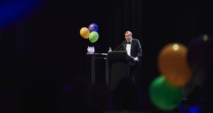 man making a speech at podium