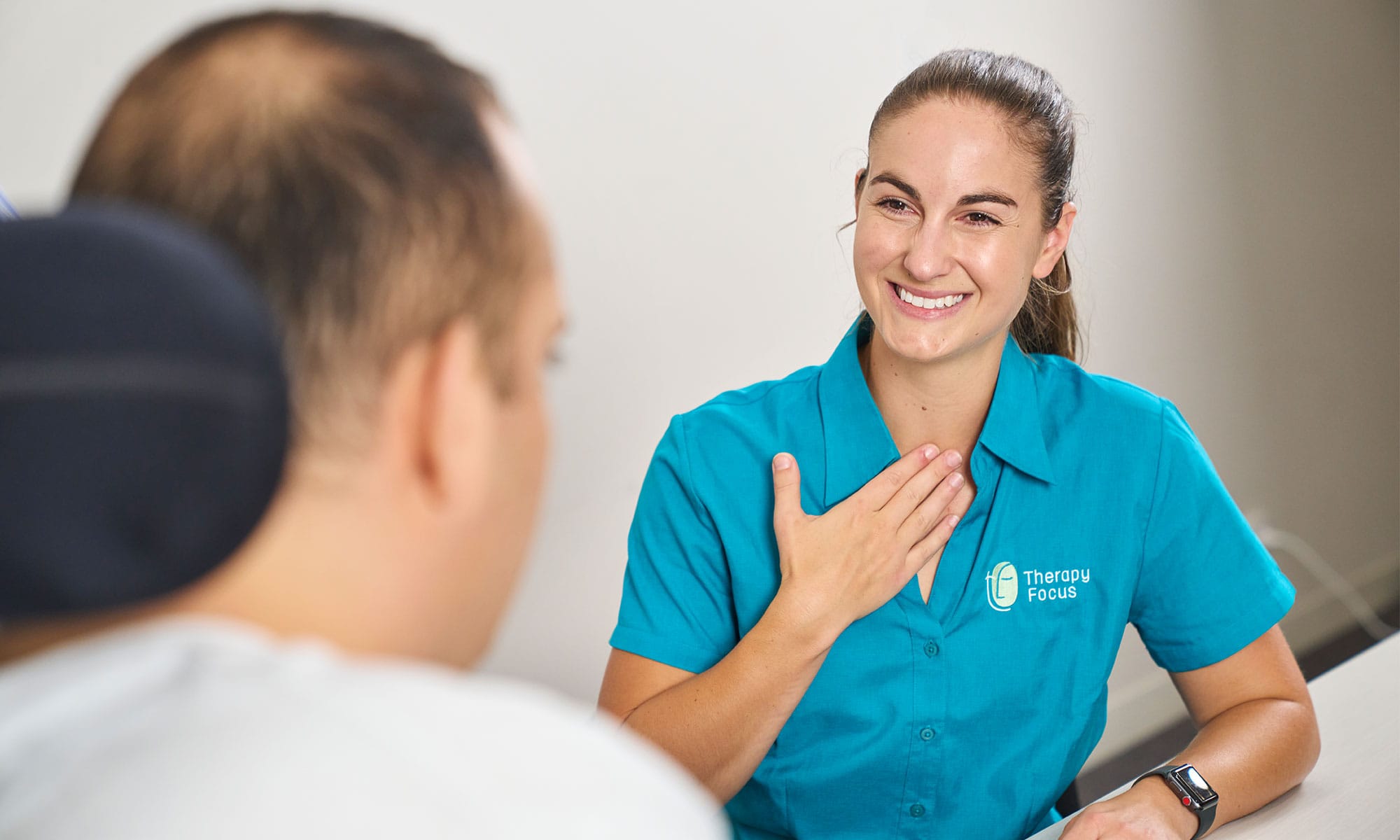 Female therapist smiling at customer