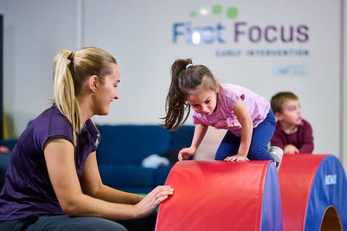 First Focus - girl on play equipment