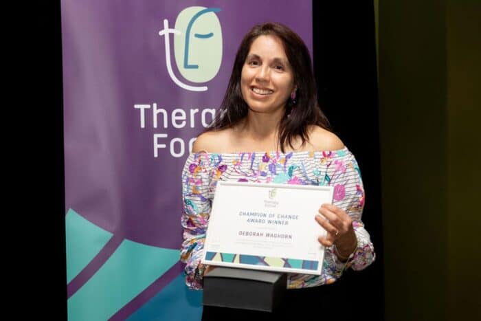 Deborah Waghorn holding her award